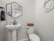 Powder room features pedestal sink and decor at 14881 Chicago St, Parker, CO 80134