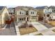 Charming two-story home with a manicured lawn, inviting front porch, and attached two-car garage at 14881 Chicago St, Parker, CO 80134
