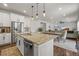Open-concept kitchen with granite countertops, stainless steel appliances, and seamless flow into the dining and living areas at 14881 Chicago St, Parker, CO 80134