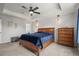 Cozy main bedroom with a ceiling fan, decorative wall, and a comfortable bed at 14881 Chicago St, Parker, CO 80134