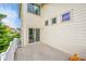 Back deck with a view of the lush landscaping, decorative windows and a sliding glass door at 20532 E Lake Cir, Centennial, CO 80016
