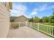 View from the back deck showcases a well-maintained yard and neighboring homes at 20532 E Lake Cir, Centennial, CO 80016