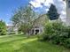 Lush green backyard with mature trees, offering a serene view and a sense of privacy, perfect for relaxation at 20532 E Lake Cir, Centennial, CO 80016