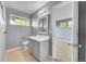 Bathroom featuring a single sink vanity, tile flooring, and view into bedroom at 20532 E Lake Cir, Centennial, CO 80016