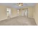 Spacious bedroom with a ceiling fan, neutral carpet, and ample closet space at 20532 E Lake Cir, Centennial, CO 80016