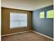 Cozy bedroom featuring dual-tone paint scheme with carpet flooring and natural light at 20532 E Lake Cir, Centennial, CO 80016
