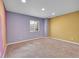 Bright bedroom featuring soft carpet, neutral paint, and natural light from the window at 20532 E Lake Cir, Centennial, CO 80016