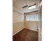 Walk-in closet featuring wire shelving, neutral walls, and carpeted floors, illuminated by a ceiling light and natural light at 20532 E Lake Cir, Centennial, CO 80016
