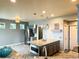 Well-equipped kitchen with stainless steel appliances, granite countertops, and a large island with a breakfast bar at 20532 E Lake Cir, Centennial, CO 80016