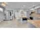 Modern kitchen featuring stainless steel appliances, a center island, and stylish gray cabinetry at 20532 E Lake Cir, Centennial, CO 80016