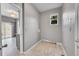 Spacious laundry room with tile flooring and natural light, ready for appliances at 20532 E Lake Cir, Centennial, CO 80016