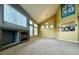 Inviting living room with vaulted ceilings, a fireplace, and lots of windows for ample natural light at 20532 E Lake Cir, Centennial, CO 80016