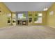 Spacious living room featuring a stone fireplace and abundant natural light at 20532 E Lake Cir, Centennial, CO 80016