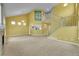 Bright living room with staircase, large windows, fireplace, and high ceilings at 20532 E Lake Cir, Centennial, CO 80016