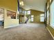 Bright living room with vaulted ceilings, a fireplace, a staircase, and large windows for ample natural light at 20532 E Lake Cir, Centennial, CO 80016