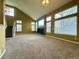 Spacious living room featuring a fireplace, vaulted ceilings, and large windows providing plenty of natural light at 20532 E Lake Cir, Centennial, CO 80016
