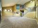 Open-concept living room featuring a vaulted ceiling, carpet floors, and a staircase to the upper level at 20532 E Lake Cir, Centennial, CO 80016