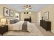 Inviting main bedroom featuring a sloped ceiling, neutral walls, and complete bedroom set at 20532 E Lake Cir, Centennial, CO 80016