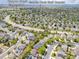 An aerial view of a neighborhood highlighting the location of Canyon Creek Elementary and Saddle Rock Golf Course at 5733 S Yakima Way, Aurora, CO 80015