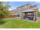 Spacious backyard with a patio area, a gazebo, and lush green grass at 5733 S Yakima Way, Aurora, CO 80015