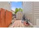 Backyard with a brick pathway, shed, and utility storage area, offering practical outdoor solutions at 5733 S Yakima Way, Aurora, CO 80015