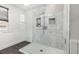 Modern bathroom featuring a glass-enclosed shower with tile accents and a rainfall showerhead at 5733 S Yakima Way, Aurora, CO 80015