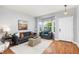 Cozy living room featuring hardwood floors, a bay window, and comfortable seating at 5733 S Yakima Way, Aurora, CO 80015