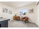 Bright office space featuring stylish furniture and a window offering natural light at 5733 S Yakima Way, Aurora, CO 80015