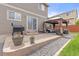 Outdoor patio featuring a grill, sliding glass doors, and cozy seating area with a gazebo at 5733 S Yakima Way, Aurora, CO 80015