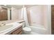 Cozy bathroom featuring pink tiles, tub with shower, and matching vanity at 9873 Greensview Cir, Lone Tree, CO 80124