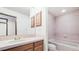 Bright bathroom with a combination tub and shower at 9873 Greensview Cir, Lone Tree, CO 80124