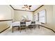 Traditional dining room featuring a wooden table with seating for six and a ceiling fan at 9873 Greensview Cir, Lone Tree, CO 80124