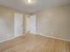 Bright bedroom with hardwood floors and two doors at 3055 Carson St, Aurora, CO 80011