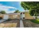 Charming brick home with an attached garage and low-maintenance front yard landscaping at 3055 Carson St, Aurora, CO 80011