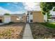 Charming brick home with an attached garage and low-maintenance front yard landscaping at 3055 Carson St, Aurora, CO 80011