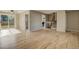 Open living room featuring hardwood floors, neutral paint and sliding glass door to outside at 3055 Carson St, Aurora, CO 80011