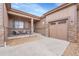 Inviting front porch with stone pillars and a covered seating area, leading to a two-car garage at 27615 E Moraine Dr, Aurora, CO 80016