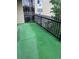 Spacious outdoor balcony with artificial turf and black metal railings, providing a private and refreshing open-air living experience at 13601 E Marina Dr # 508, Aurora, CO 80014