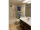 Bathroom featuring a shower/tub combo with a shower curtain and a vanity with ample counter space at 13601 E Marina Dr # 508, Aurora, CO 80014
