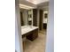 Bathroom vanity featuring 2 mirrors and cabinet space at 13601 E Marina Dr # 508, Aurora, CO 80014