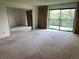 Spacious living area offering views of the balcony and kitchen, creating an open and inviting atmosphere for relaxation and entertainment at 13601 E Marina Dr # 508, Aurora, CO 80014