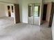 Bright living room with large sliding closet doors and entry to the Kitchen and another room at 13601 E Marina Dr # 508, Aurora, CO 80014