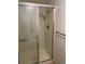 Tiled stand up shower with sliding doors and adjustable shower head at 13601 E Marina Dr # 508, Aurora, CO 80014