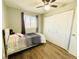 Cozy bedroom with closet, ceiling fan, and bright window at 8625 Clay St # 228, Westminster, CO 80031