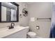 Modern bathroom with a black framed mirror and updated fixtures at 2280 S Oswego Way # 104, Aurora, CO 80014