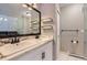 Well-lit bathroom featuring double sinks, updated fixtures, and contemporary finishes at 2280 S Oswego Way # 104, Aurora, CO 80014