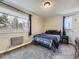 Comfortable bedroom with natural light, featuring a cozy bed, and warm colors at 2280 S Oswego Way # 104, Aurora, CO 80014