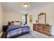 Cozy bedroom with a dresser and an ensuite bathroom at 2280 S Oswego Way # 104, Aurora, CO 80014
