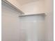 White closet interior with storage shelves and clothing rods at 2280 S Oswego Way # 104, Aurora, CO 80014