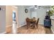 Bright dining area with wood floors and seating for four at 2280 S Oswego Way # 104, Aurora, CO 80014
